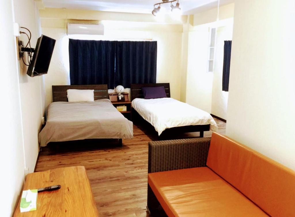 Ένα ή περισσότερα κρεβάτια σε δωμάτιο στο Yoron Tandy-House - Vacation STAY 78660v