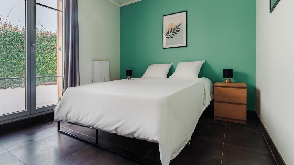 Ένα ή περισσότερα κρεβάτια σε δωμάτιο στο Appartement Spacieux - Disney