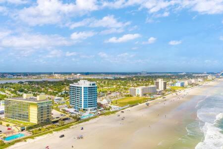 an aerial view of a beach with buildings and the ocean at Oceanside Duo - Double Room, Water Views, Pool & Beach Access, Free Parking in Daytona Beach