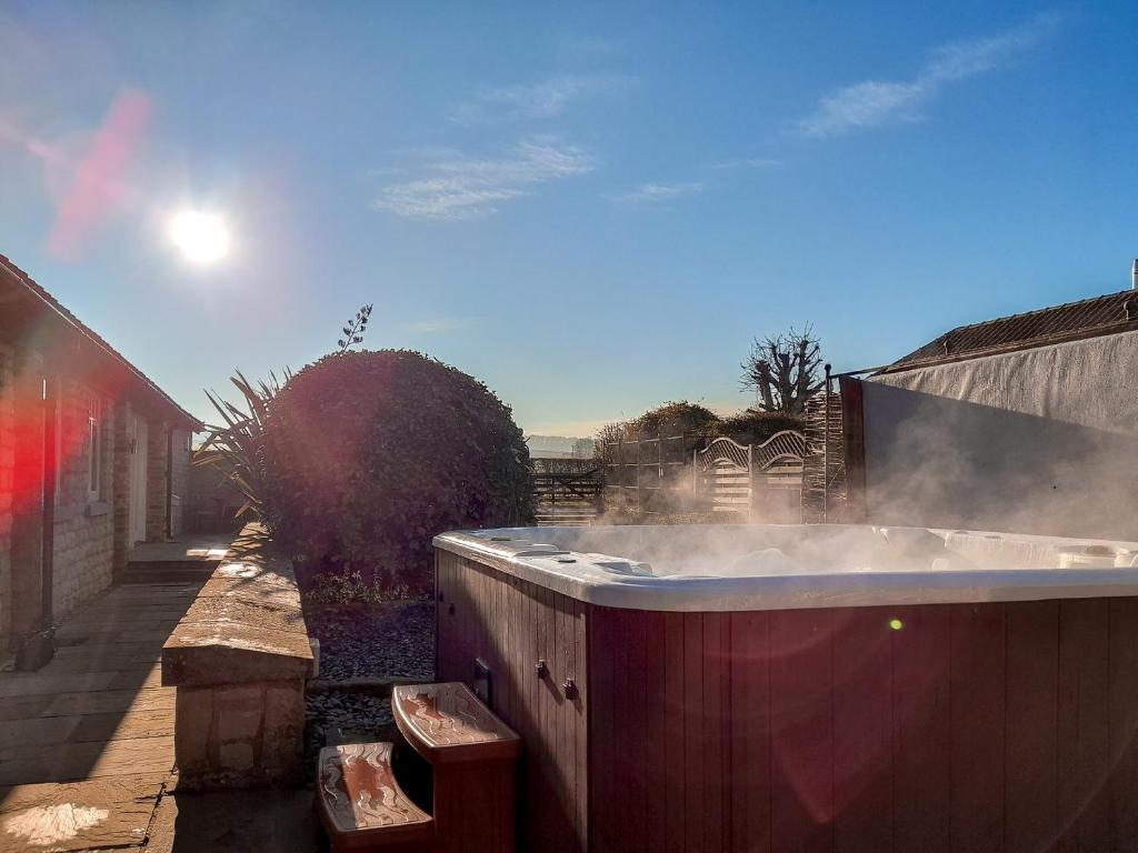 a hot tub with smoke coming out of it at 4 bed in Hovingham G0146 in Hovingham