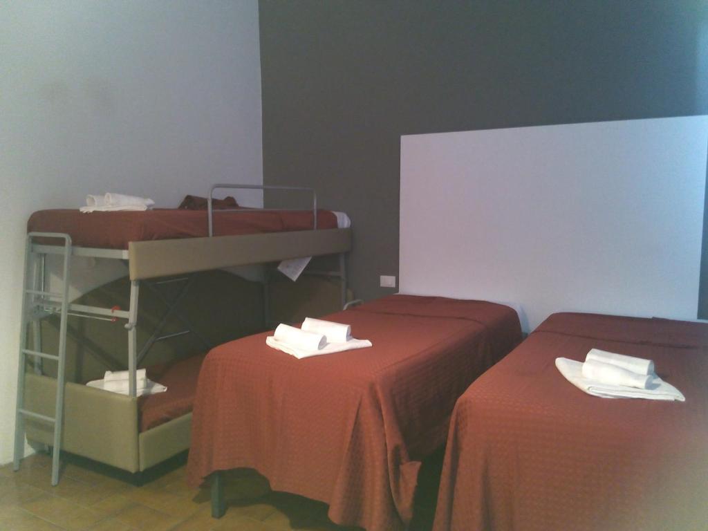 Postel nebo postele na pokoji v ubytování Hotel Piccola Firenze