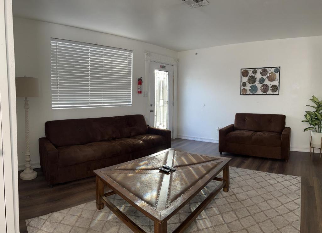 a living room with a couch and a coffee table at Very cute and comfy Apartment in Las Vegas