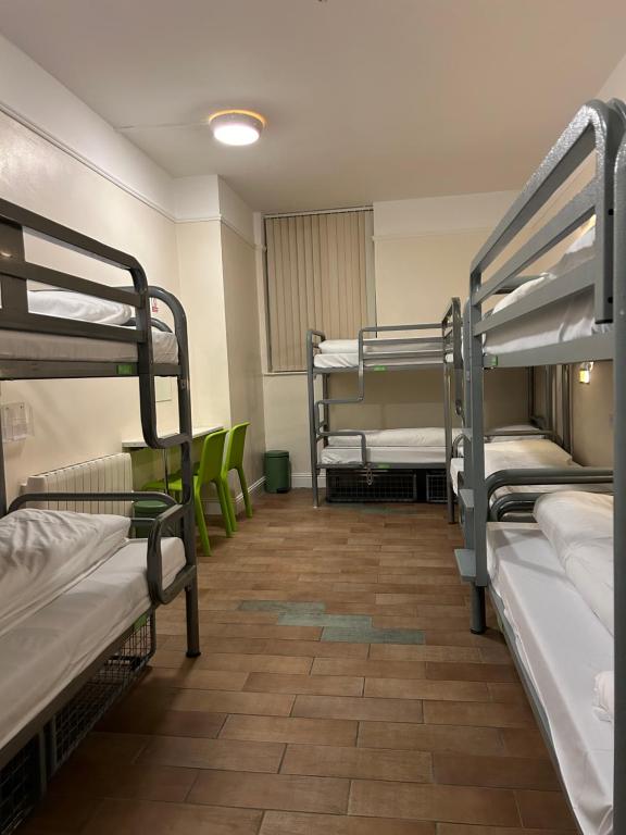 a dorm room with several bunk beds in it at Gogartys Temple Bar Hostel in Dublin