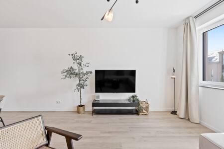 TV a/nebo společenská místnost v ubytování Stylish Retreat in Bivange Roeser