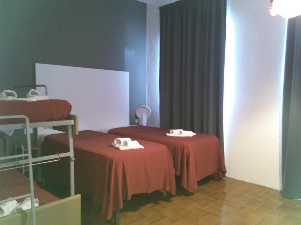 Postel nebo postele na pokoji v ubytování Hotel Piccola Firenze