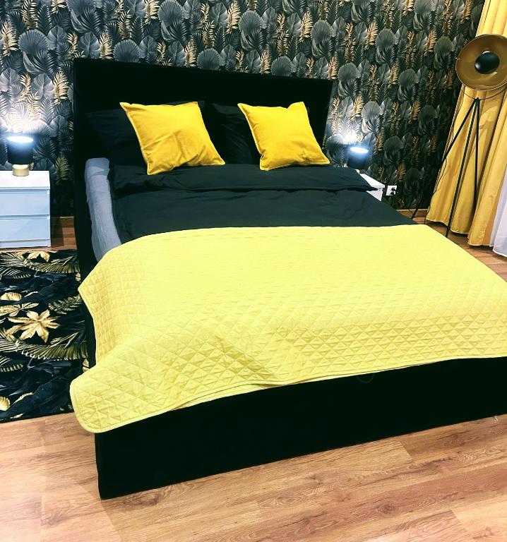 Кровать или кровати в номере Apartament Tatarska 6