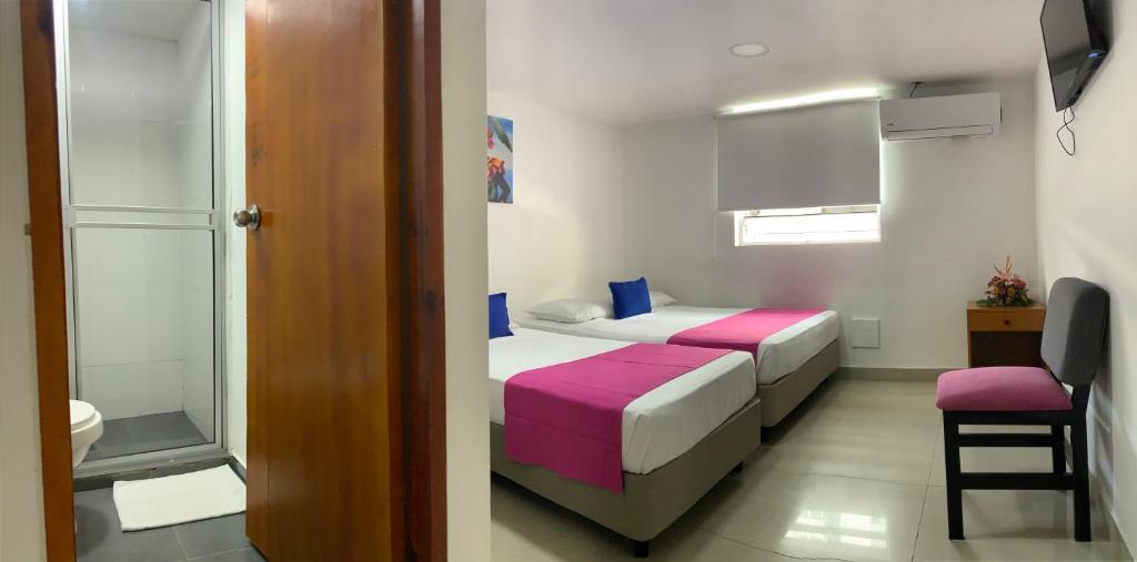 Postel nebo postele na pokoji v ubytování Hotel ITACO