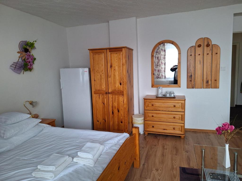 Postel nebo postele na pokoji v ubytování Vila Gabriel