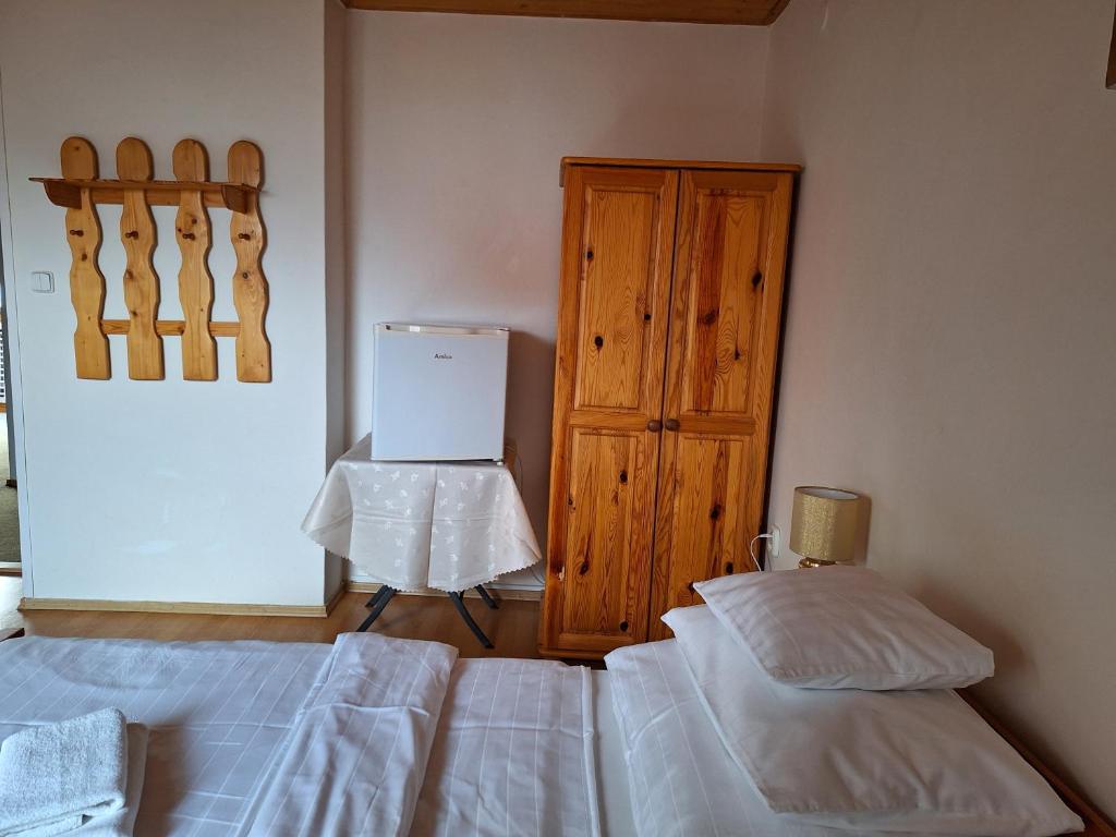 Postel nebo postele na pokoji v ubytování Vila Gabriel