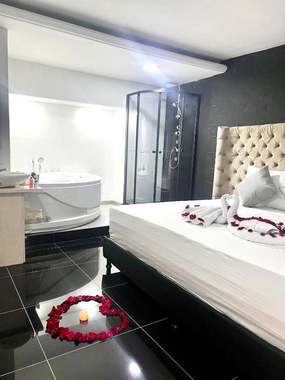 Postel nebo postele na pokoji v ubytování Orbe Hotel Medellín