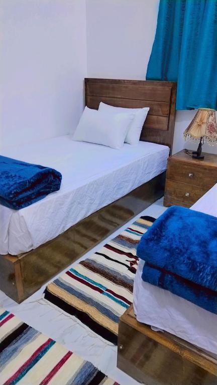 Postel nebo postele na pokoji v ubytování Sama Stars Hotel