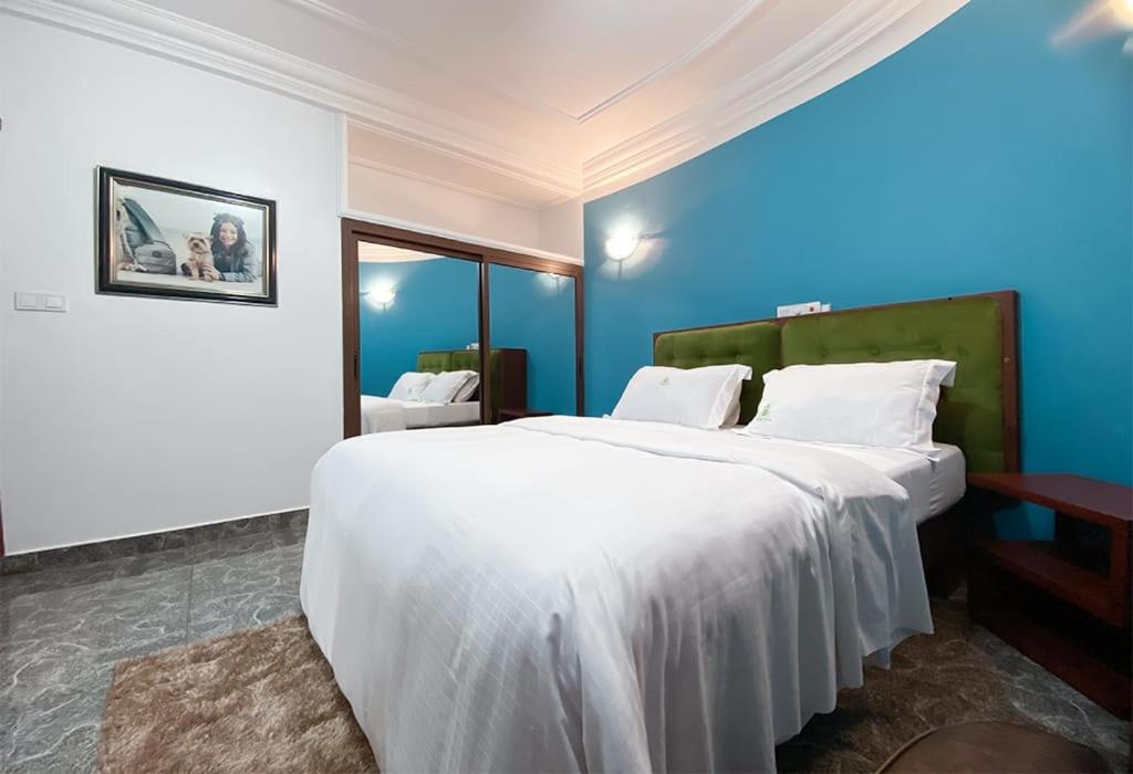 Postel nebo postele na pokoji v ubytování Double twins Hotel & Suites
