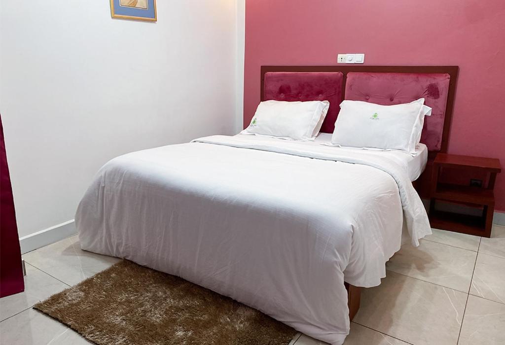 Postel nebo postele na pokoji v ubytování Double twins Hotel & Suites
