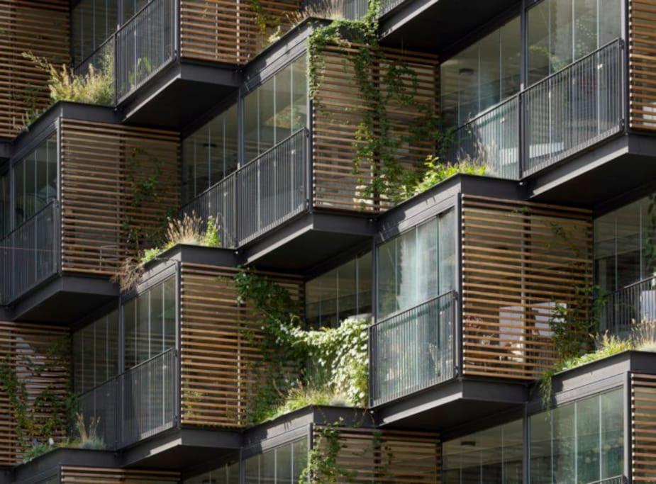 a building with plants on the side of it at Central family home in award-winning architecture in Copenhagen