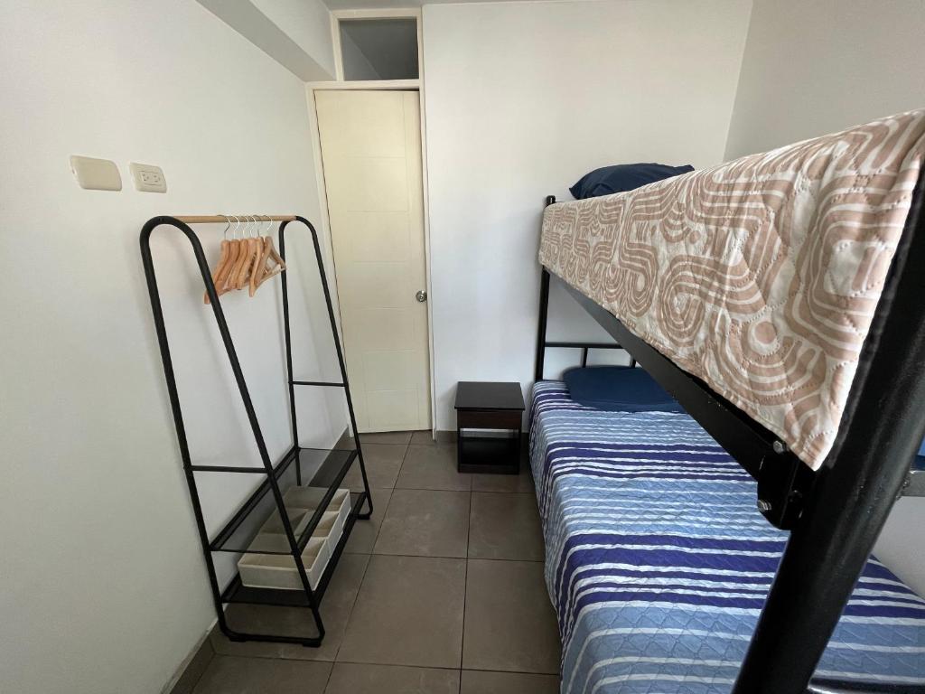 Postel nebo postele na pokoji v ubytování Departamento Compartido San Isidro