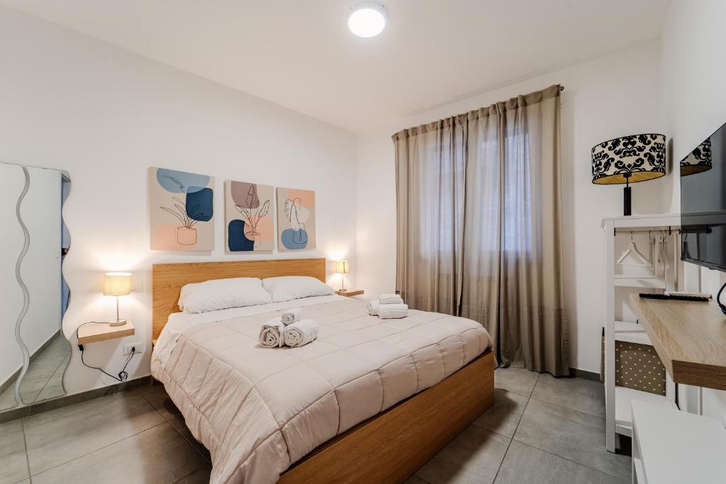 Postel nebo postele na pokoji v ubytování Tarzanà 11 apartment - Cala di Palermo