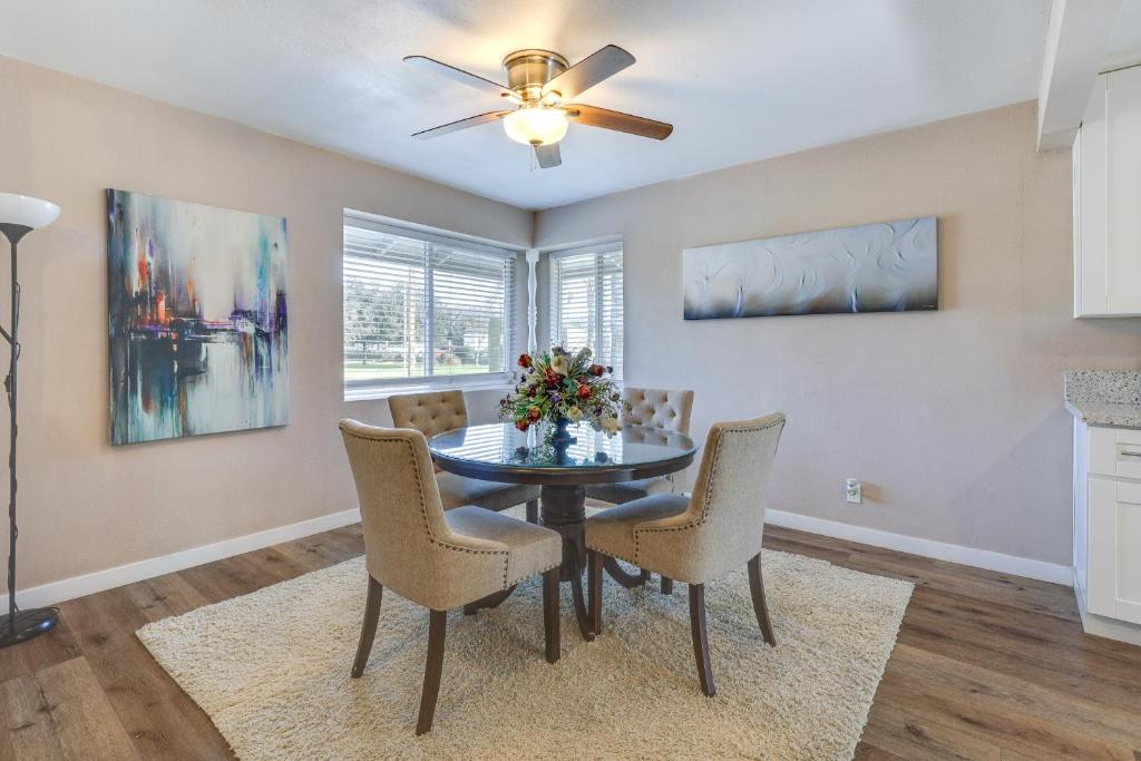 a dining room with a table and chairs and a ceiling fan at Escondido Vacation Rental about 1 Mi to Grape Day Park in Escondido