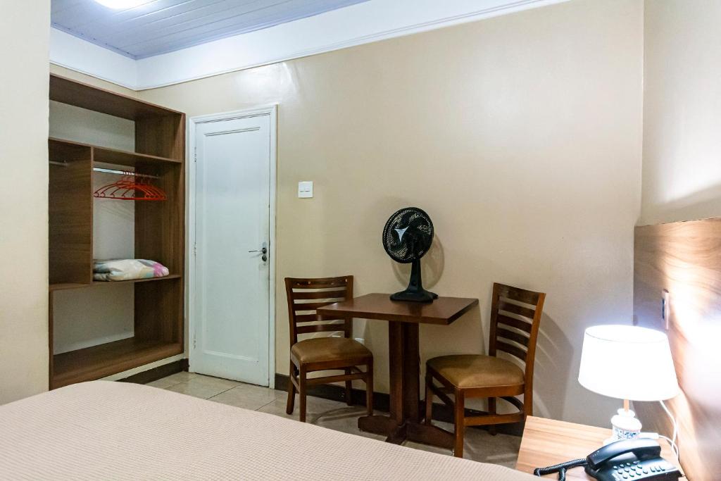 Postel nebo postele na pokoji v ubytování Hotel Excelsior