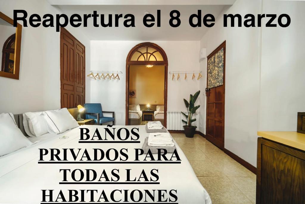 a hotel room with a bed with the words pandas panzaiboazaaza at Santa Rita Rita B&B in Talavera de la Reina