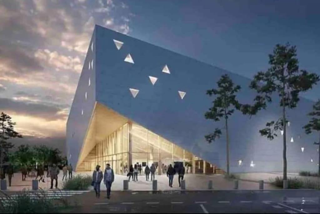 a rendering of a building with people walking outside at Maison avec extérieur à 5 min du futuroscope in Jaunay-Clan