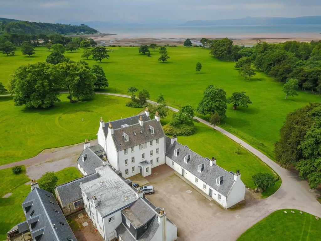 an aerial view of an old castle with a green field at 2 Bed in Applecross CA422 in Applecross