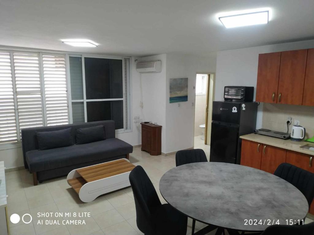 a living room with a couch and a table at Amir's Apartments in Tel Aviv