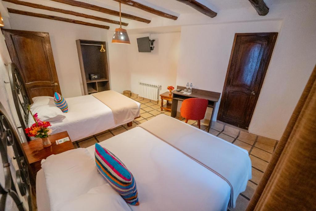 Postel nebo postele na pokoji v ubytování Vilas Insight Hotel Machupicchu