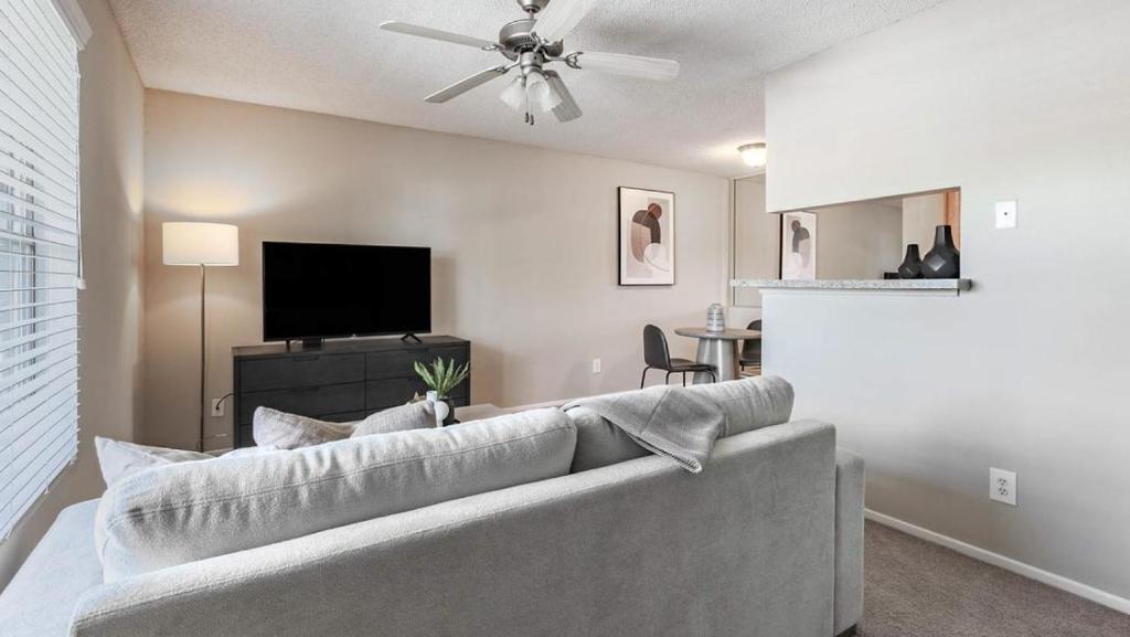 a living room with a couch and a flat screen tv at Landing Modern Apartment with Amazing Amenities (ID9665X12) in Seabrook