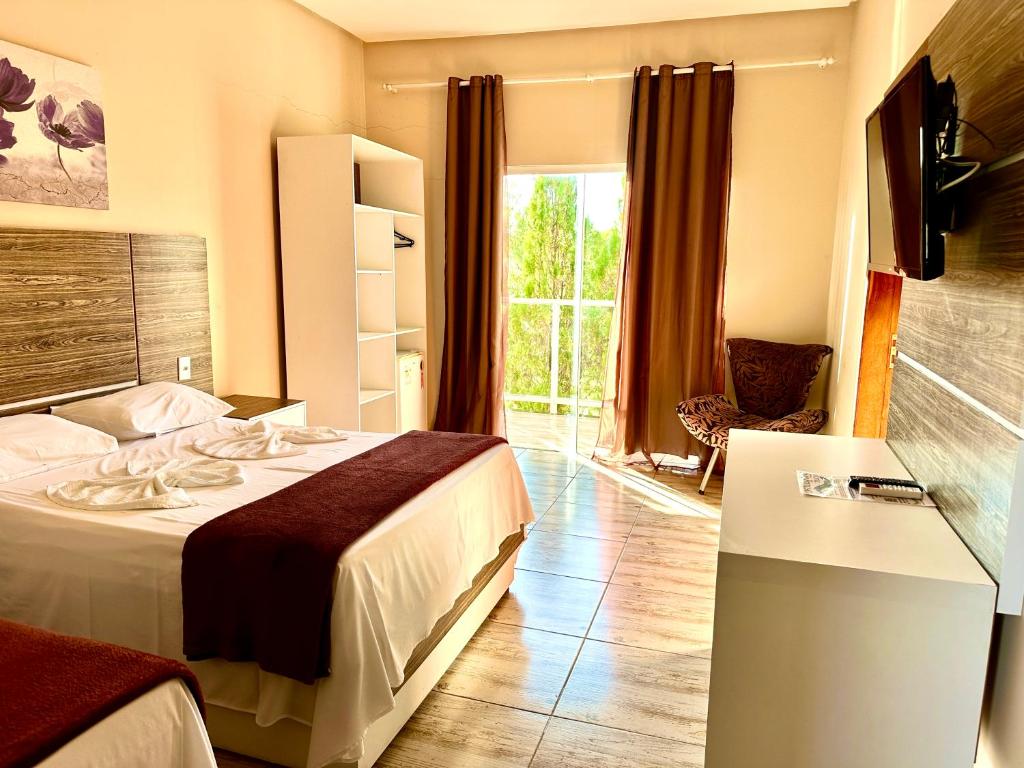 Postel nebo postele na pokoji v ubytování Hotel São Francisco