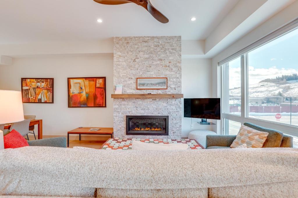 a living room with a fireplace and a couch at Silverthorne Mountain Retreat Near A-Basin! in Silverthorne