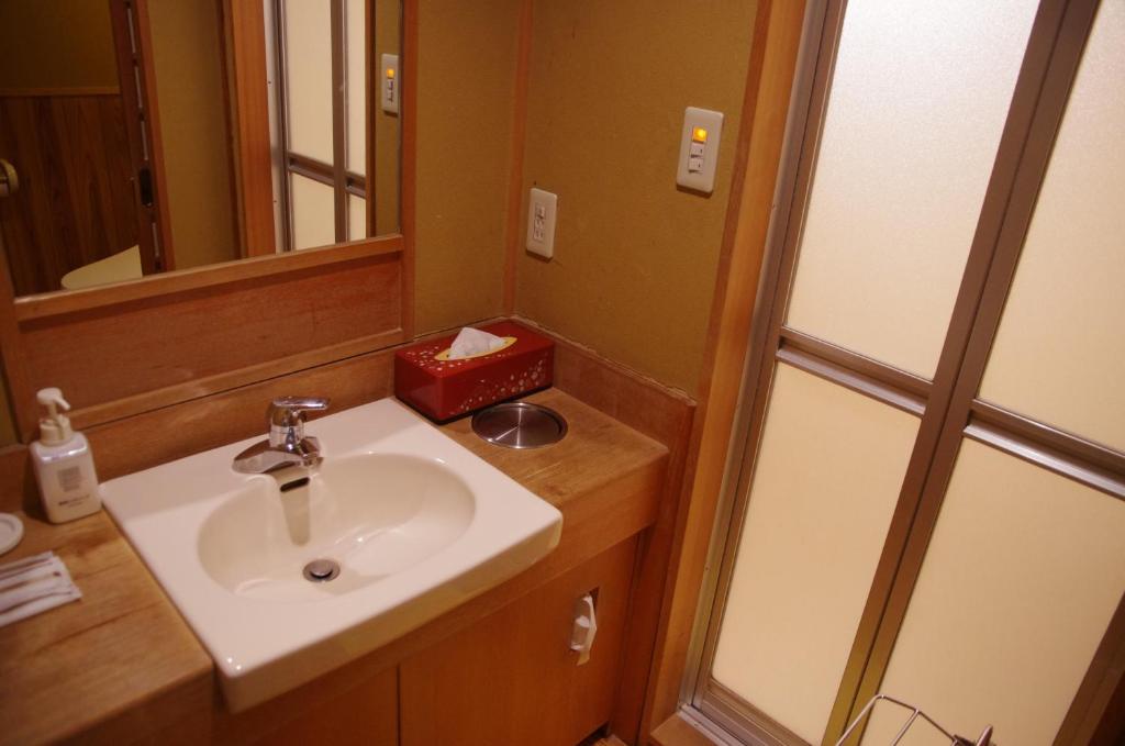 Koupelna v ubytování Hotel Umenoyu