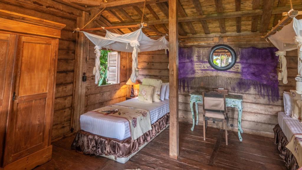 Postel nebo postele na pokoji v ubytování Ratua Private Island Resort