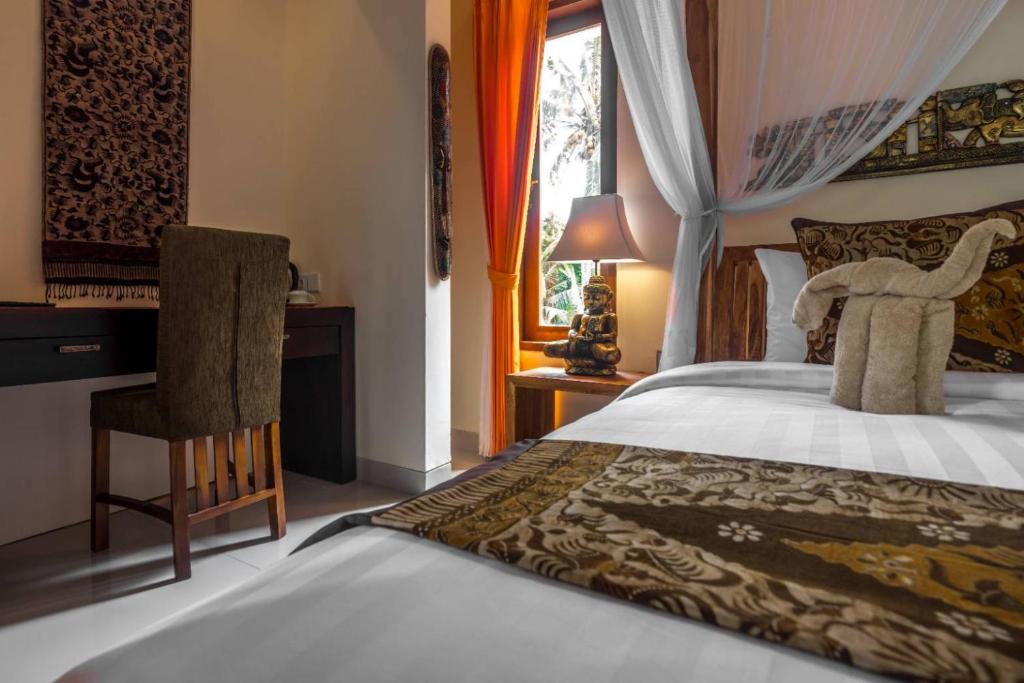 Postel nebo postele na pokoji v ubytování Gefecon Villa Ubud