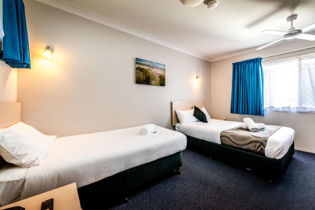 Postel nebo postele na pokoji v ubytování Park Beach Resort Motel