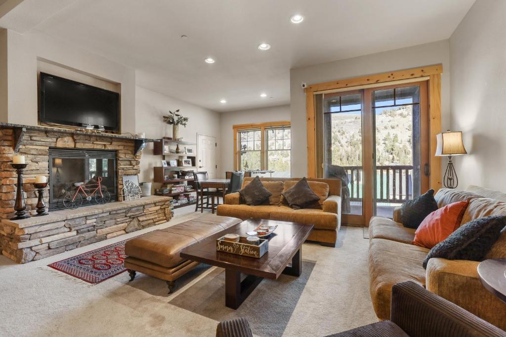 a living room with a couch and a fireplace at Lavishness at Elevation – Timber Ridge 3 Bedroom condo in Kirkwood
