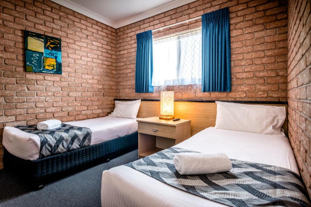 Postel nebo postele na pokoji v ubytování Park Beach Resort Motel