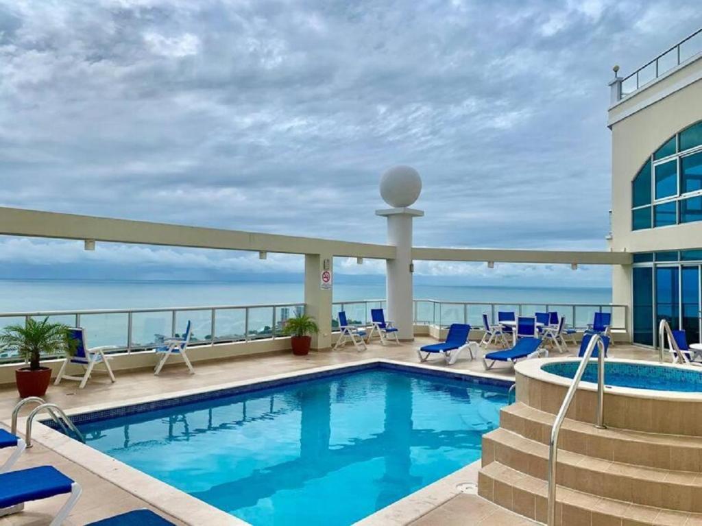 a swimming pool on the roof of a hotel at Amazing Ocean View Luxury Condo in Coronado Panama in Playa Coronado
