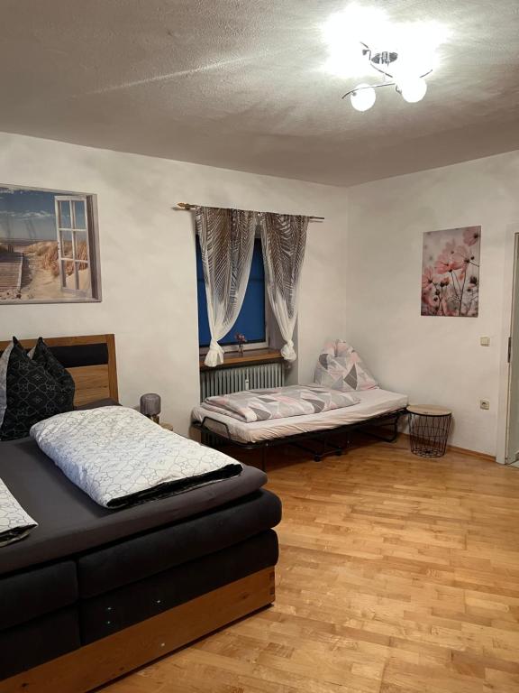 Postel nebo postele na pokoji v ubytování Ferienwohnung Eden