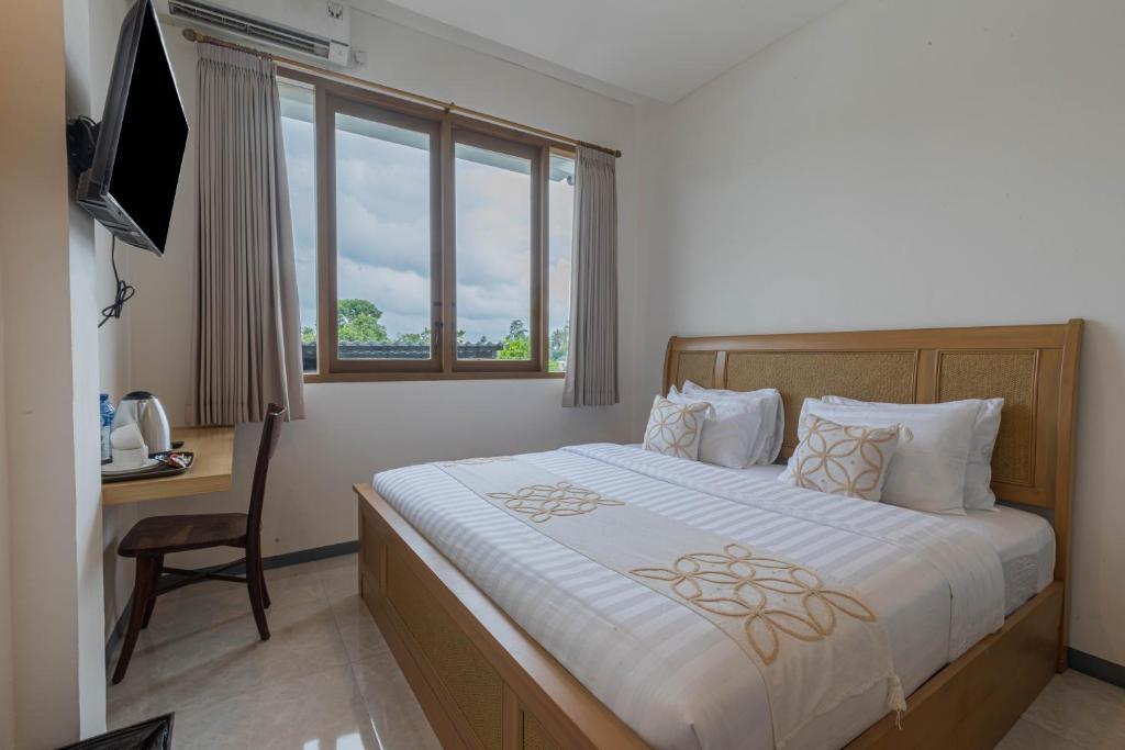 Postel nebo postele na pokoji v ubytování ME Rooms Ubud