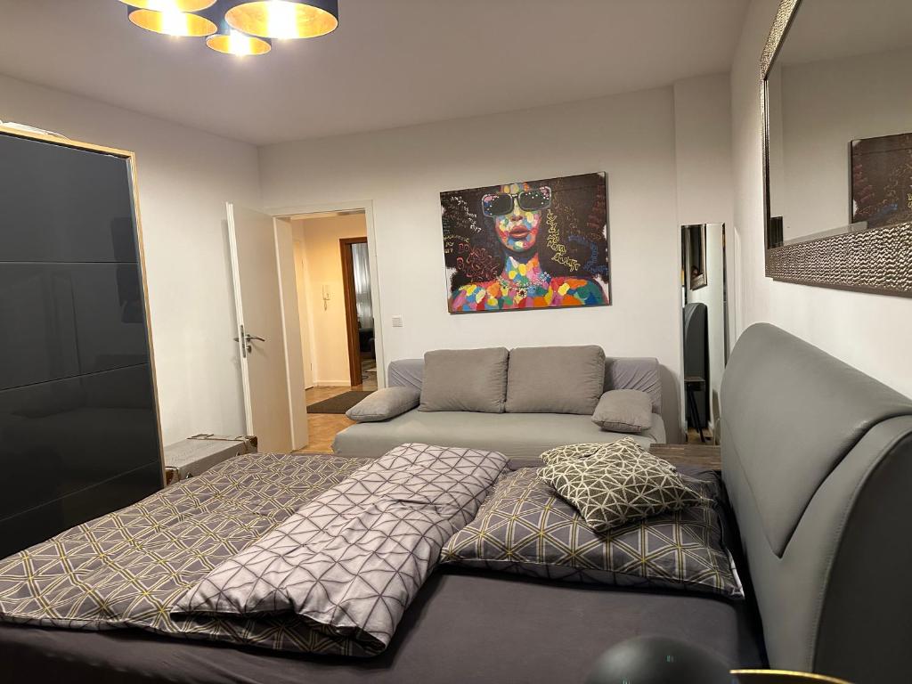 a living room with a bed and a couch at Luxus Apartment in Center Dusseldorf - 2 Rooms in Düsseldorf