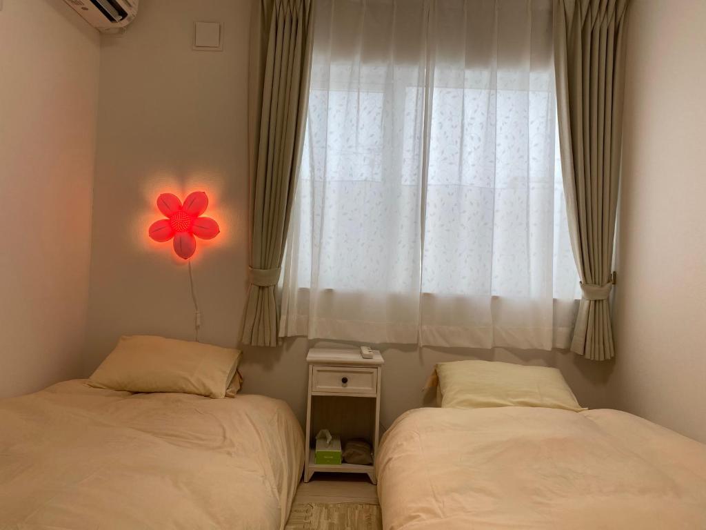En eller flere senge i et værelse på 夢富良野