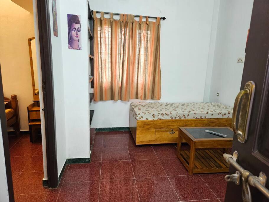 En eller flere senge i et værelse på SHI's Spanda 1bhk villa @ Coimbatore