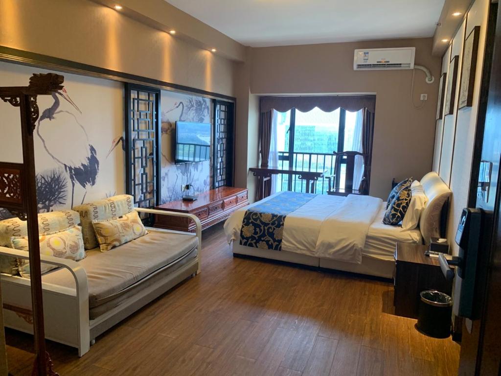 Rúm í herbergi á Pazhou Yixiu Boutique Apartment Canton Fair Branch