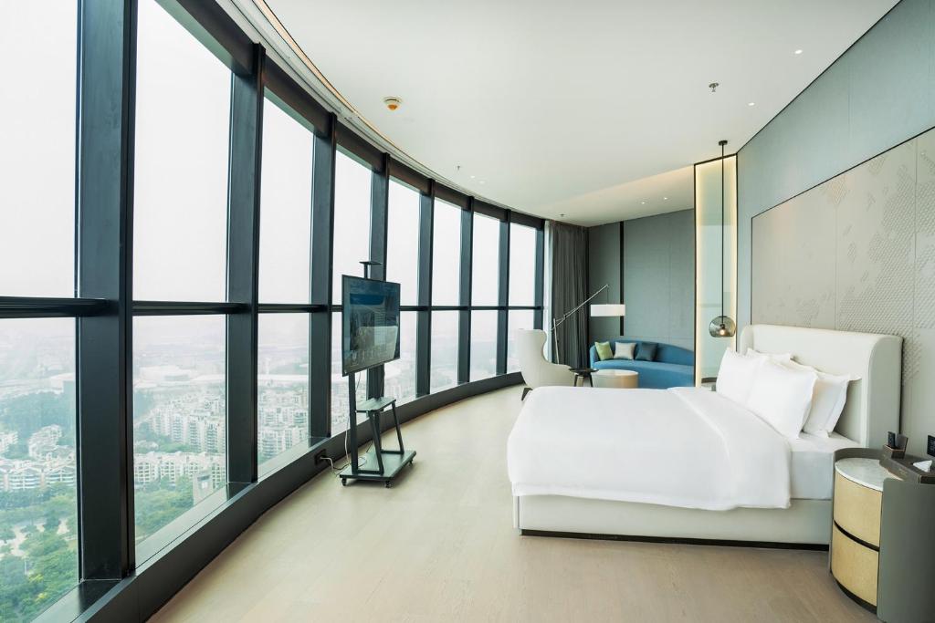 Postel nebo postele na pokoji v ubytování Wyndham Foshan Nanhai