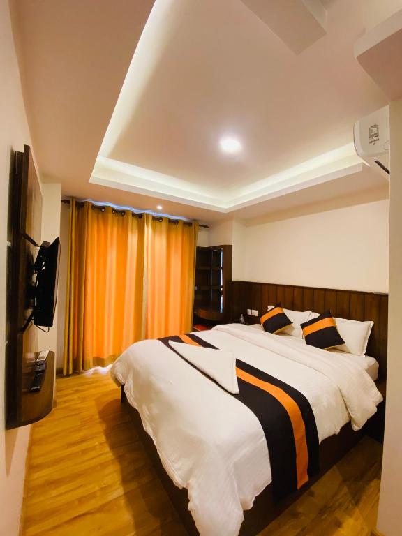 Postel nebo postele na pokoji v ubytování Hotel Abi International