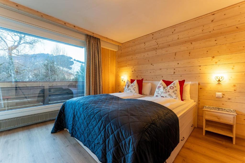 Voodi või voodid majutusasutuse Fresh & Simple near Gstaad toas