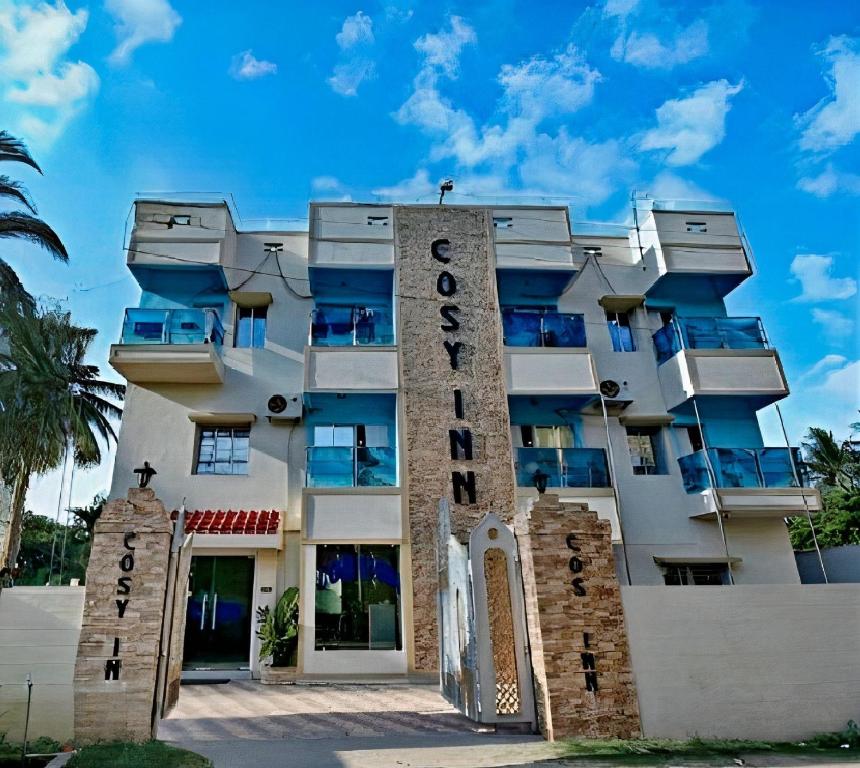 a building with the name of the hotel at Hotel Cosy Inn in Digha