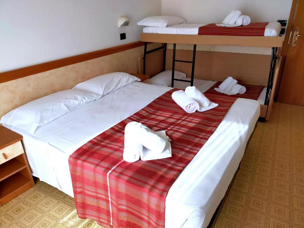 Postel nebo postele na pokoji v ubytování Ben Hur Rimini