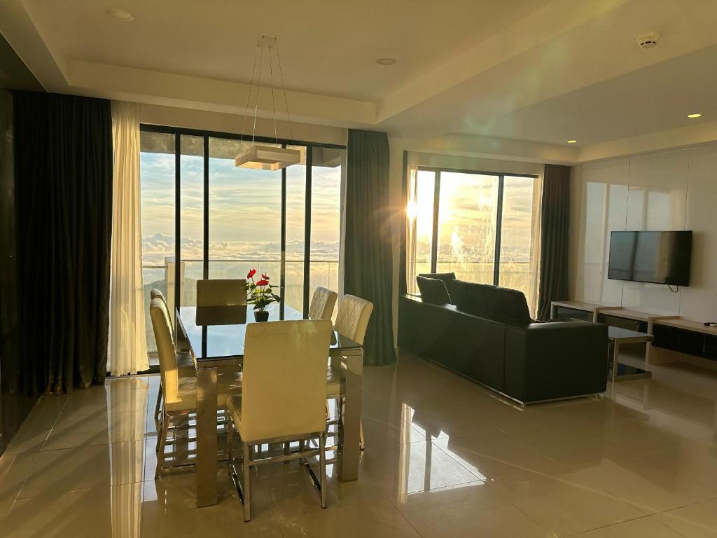 a living room with a table and a dining room at Premium Family 3BR Genting Ion Delemen in Genting Highlands
