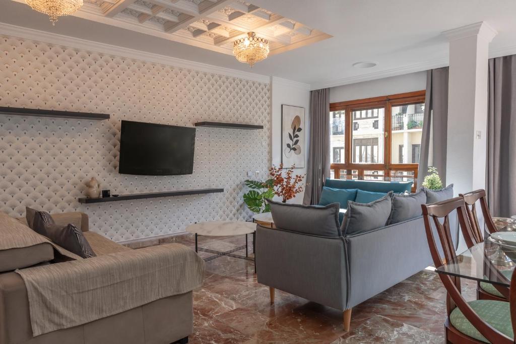 A television and/or entertainment centre at tuGuest Gran Via 42